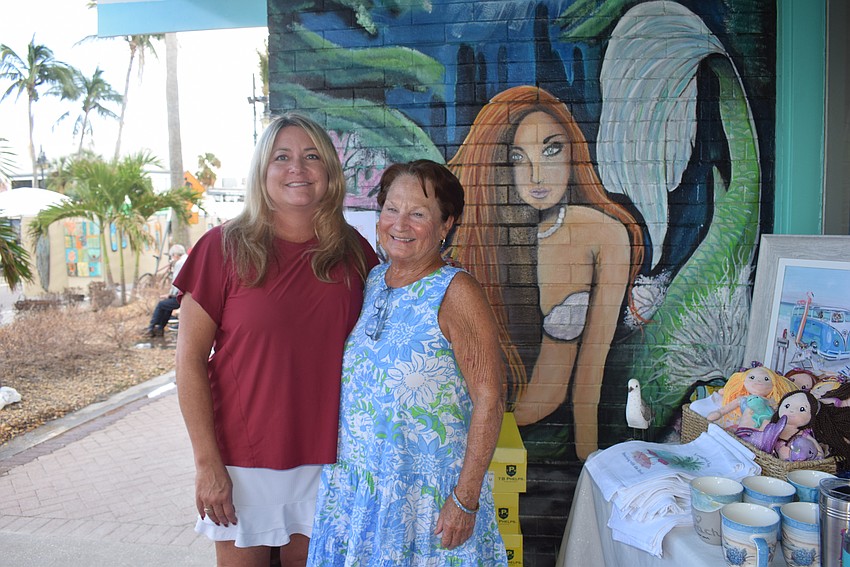 Keisha Freeman and Susan Cornett from Fugate's By The Sea during the St. Armands Circle Art Festival.
