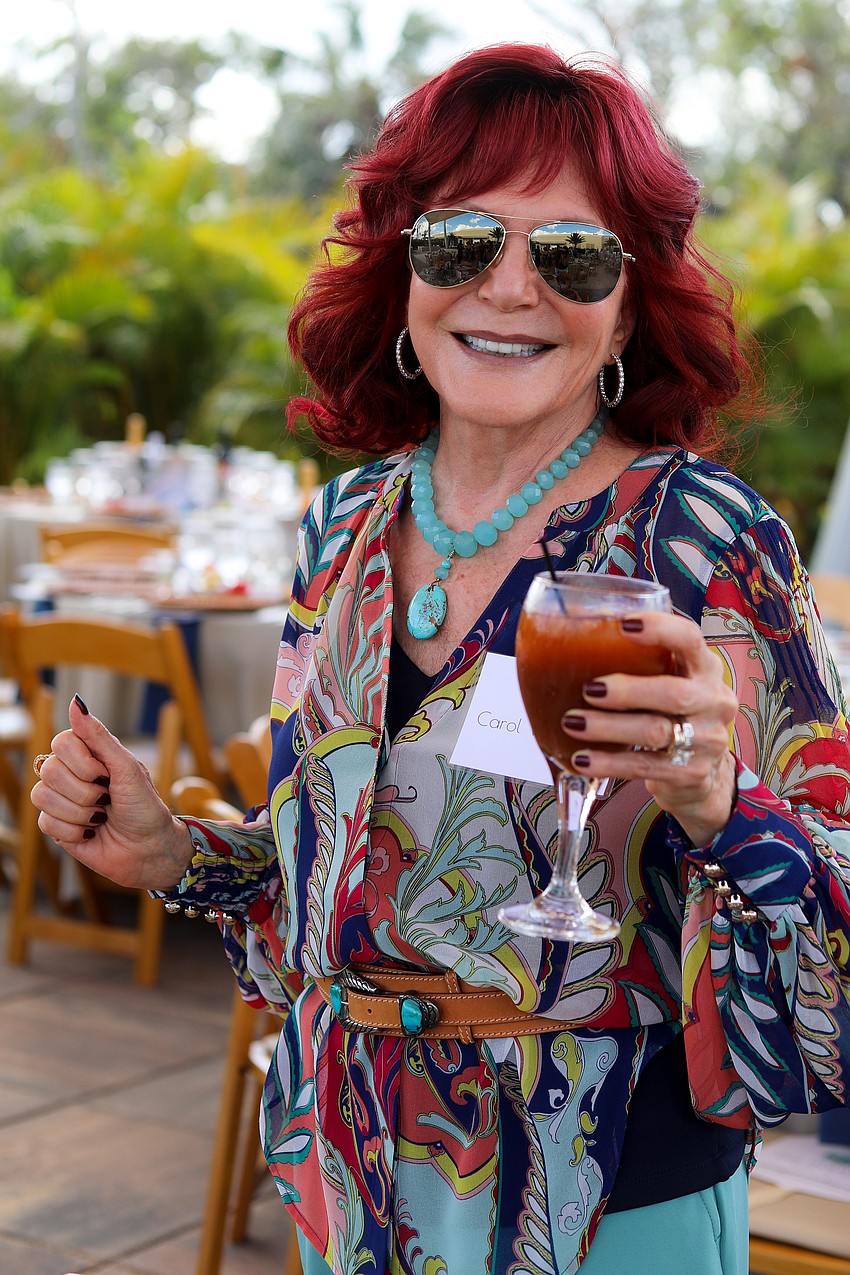 Carol White Bold celebrates shows off her colors at the Artful Loster.