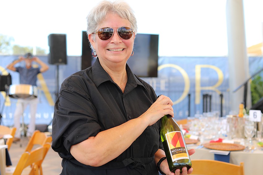 Maria Alexander pours wine from Michael's on East.