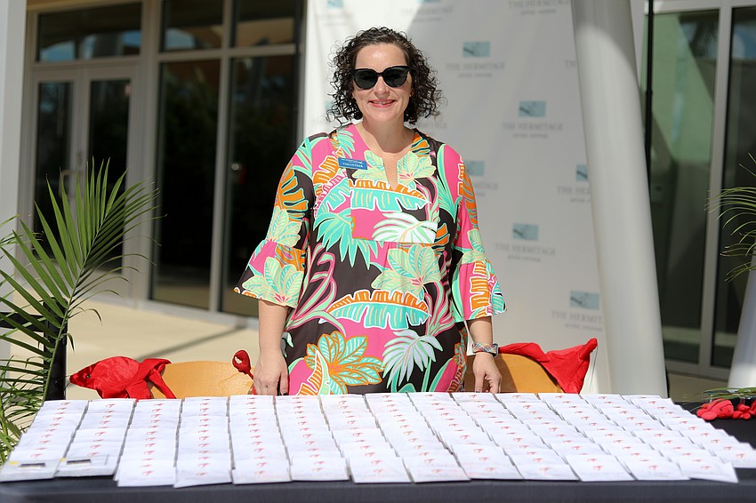 Community Foundation volunteer Kelly Borgia assists guests with registration.