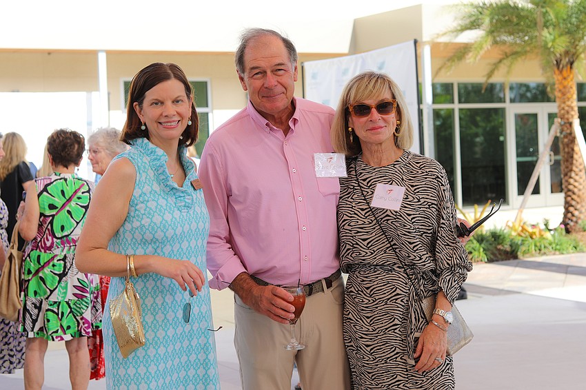 Development Director Amy Wallace with Steve and Cathy Collins