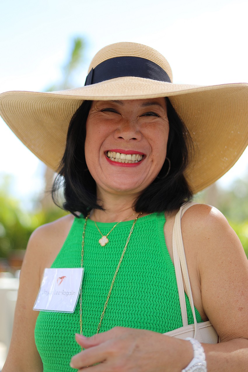 Joyce Lee-Rogalin's stylish hat is wonderful protection from the morning sun.