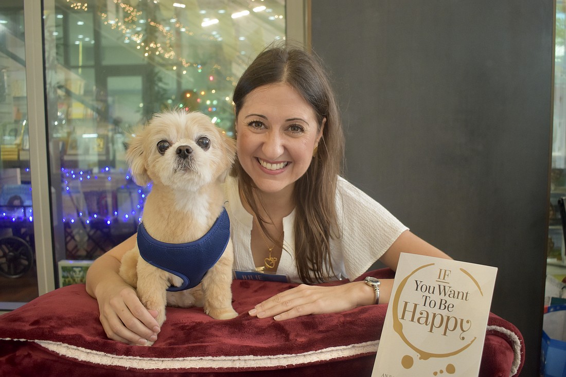 Julie Fidalgo showcased the book "If You Want to Be Happy," and brought her dog Rocky, who she said is a source of happiness.