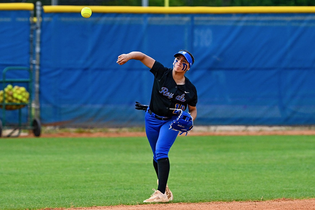 The First Academy softball player Sulexy Falcon threw the ball toward third base.