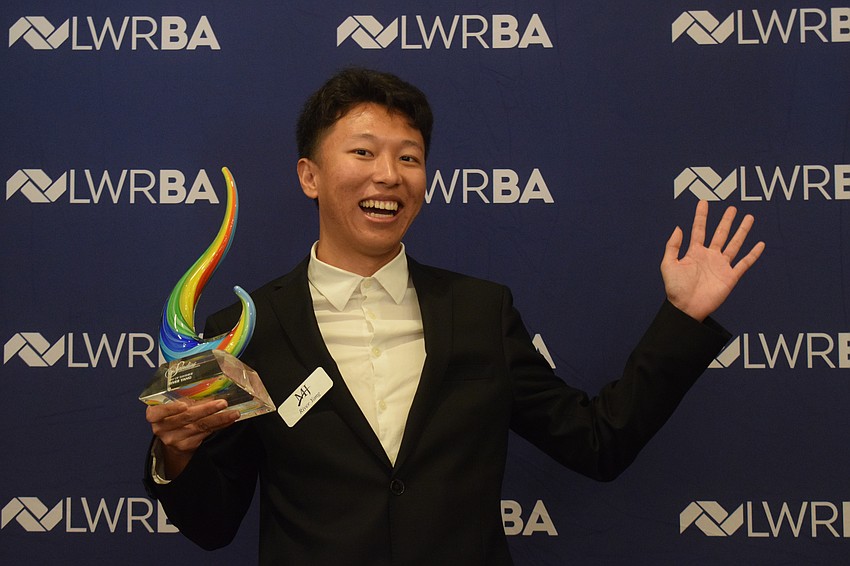 River Young of Mauldin & Jenkin is radiant after receiving the Ray of Sunshine award.