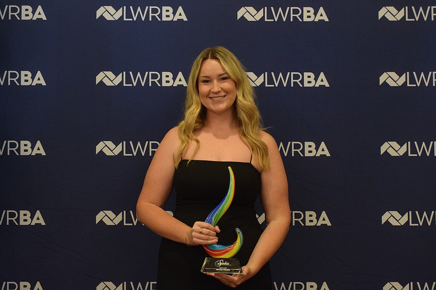 Nicole Hackel of Lakewood Ranch Communities receives the Rising Star award, which is given to a member 