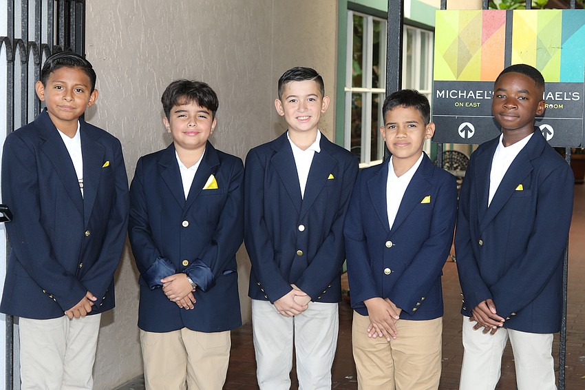 The fifth grade gentlemen of VMA are ready to escort guests to their tables. Orlando Benitez, Sahel Rico, Arthur Weatherly, Melkis Ruiz and Sammy Louis-Gene.