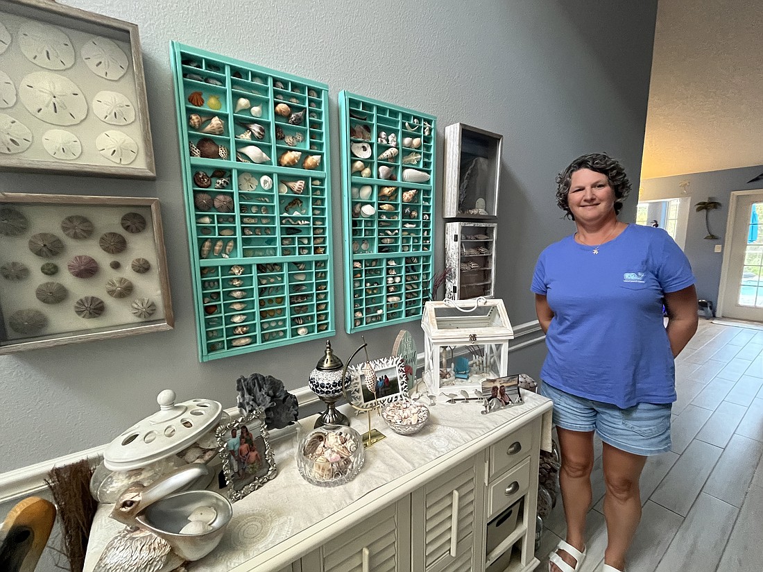 Mill Creek's Heather Caudill has her shells on display in the foyer of her home. She has collected hundreds of shells since 2020.