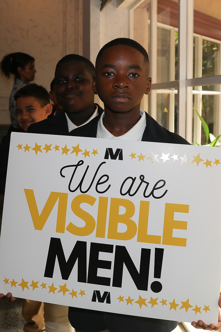 Sammy Louis-Gene leads the VMA fifth grade including Feinley Louidor and Melkis Ruis up to the stage for a presentation.