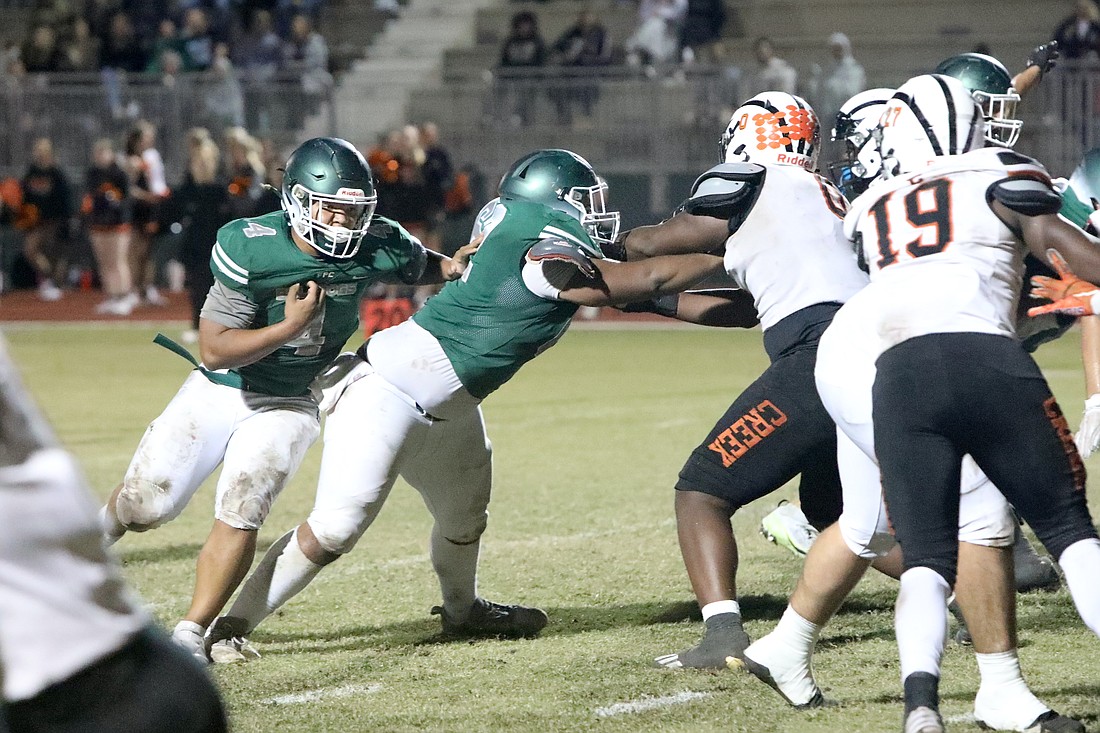 Marcus Mitchell scored three touchdowns in the game. Photo by Brent Woronoff