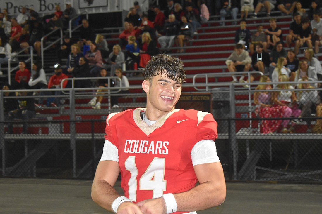 Junior quarterback Devin Mignery is all smiles during Cardinal Mooney's 55-27 win over Somerset Academy Canyons High School in the regional quarterfinals of the 2A FHSAA Football State Championship tournament.