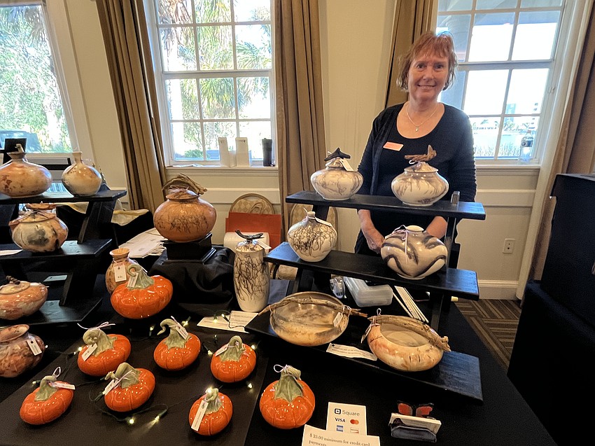 Mill Creek's Wilma Kroese adds pumpkins to her works of art this year. She has become known for using horse hair and feathers in her pottery.