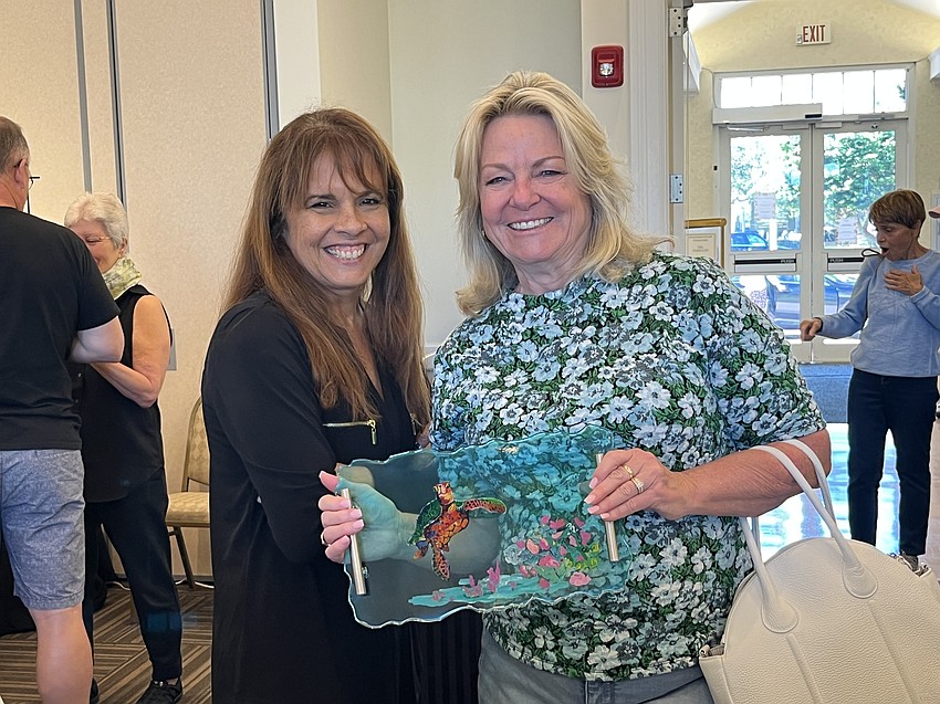 Lake Club's Lisa Sweeney talks about her resin trays with Lakewood Ranch's Kim Longhitano. 