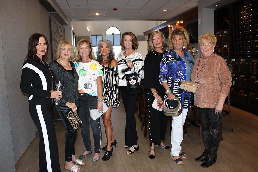 Kathy McElligott, Becky Curtain, Nancy Cole, Gloria Diaz, Linda Schultz, Julie Griffin, Jacquelyn Smith, and Susan Greene served as models during the fundraiser.