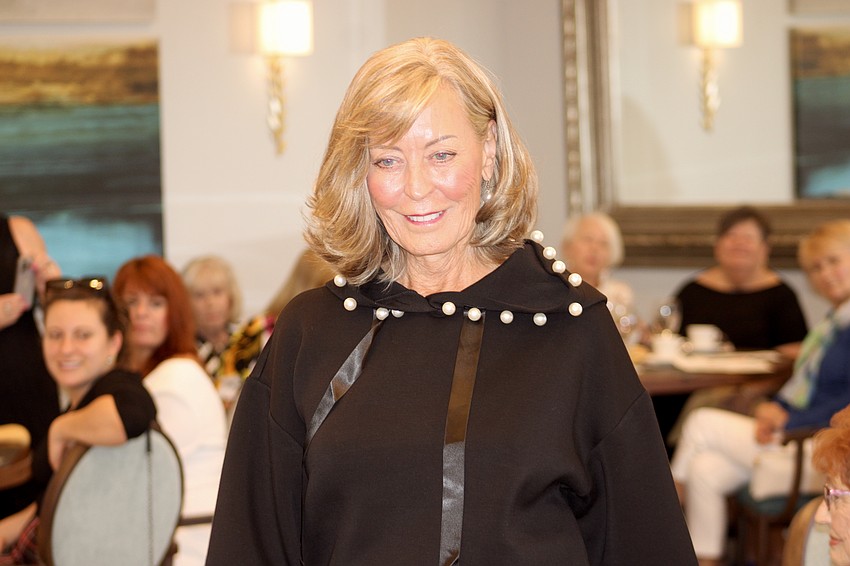 Julie Griffin draws all eyes as she walks the runway during the Waterlefe Fashion Show.