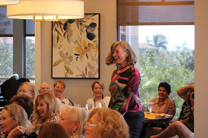 Julie Griffin is a hit in a multi-colored top.