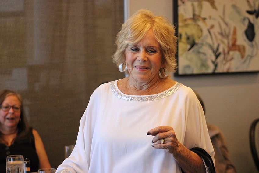 Becky Curtin shows that a plain white top can be very stylish.