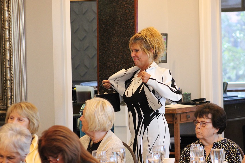 Jacquelyn Smith shows off the jacket that does along with her outfit.