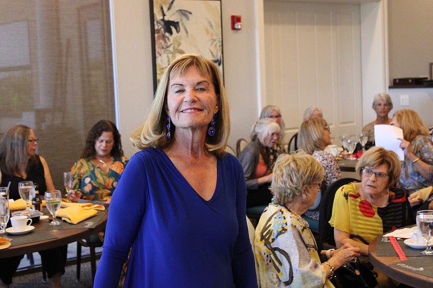 Nancy Cole might be in a blue mood, but she is smiling because of her outfit.