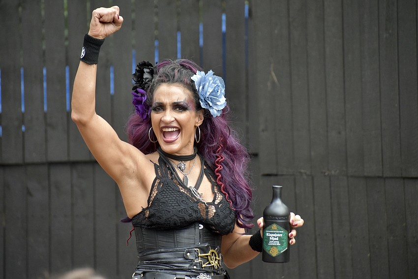 Malia Anderson pumps up the crowd at the Sarasota Medieval Faire, which is celebrating its 20-year anniversary.