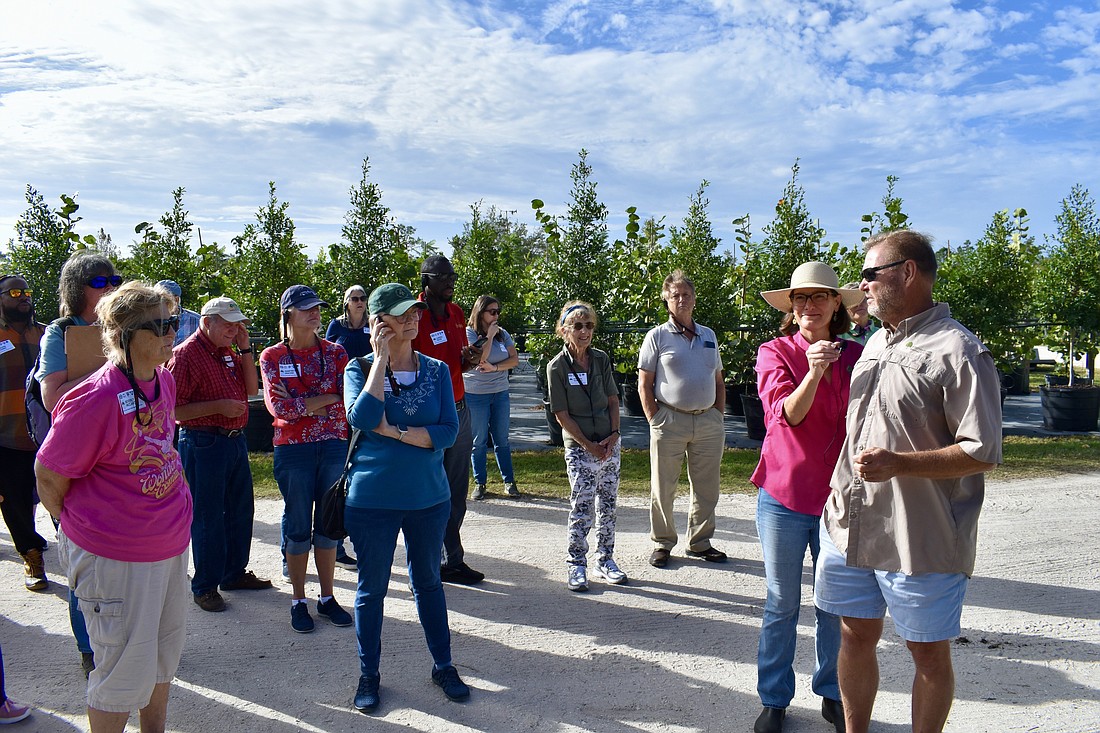 Patricia and Eddie McKeithen (on the right) lead the tour through their Myakka City tree farm, McKeithen Growers.