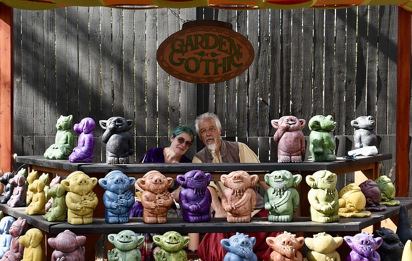 Melissa Bullis and Bonnie Hanson sell concrete garden trolls and gargoyles.