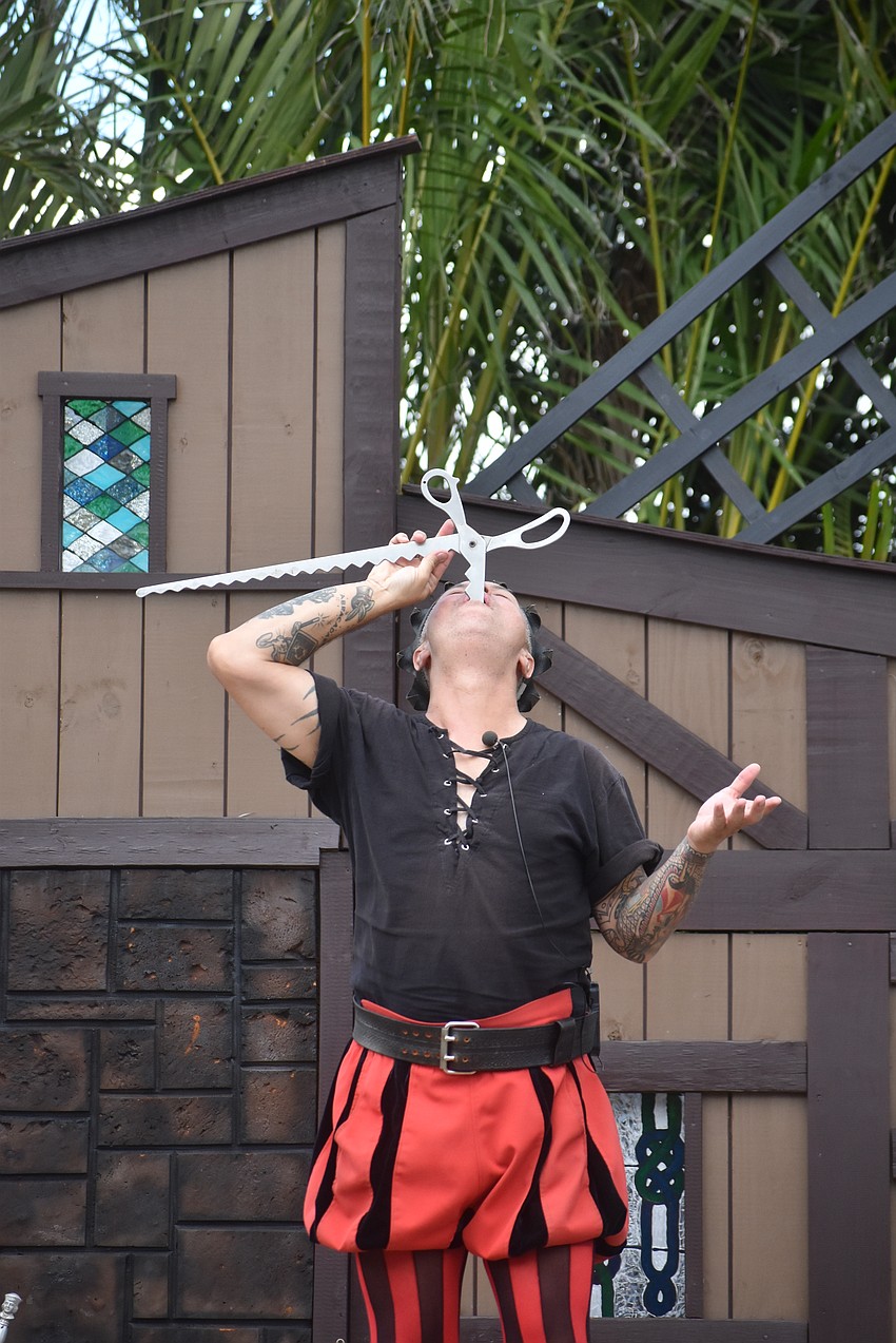 Lynx Kim swallows an oversized set of shears.