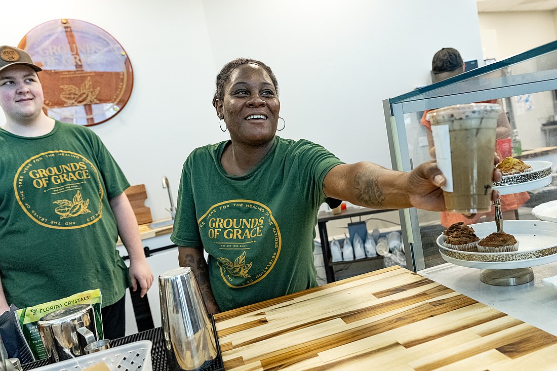 Grounds of Grace employee Bruyana Goldson serves coffee at the opening of Cinotti’s Bakery & Sandwich Shop and Grounds of Grace Coffee at the Jacksonville Transportation Authority headquarters.