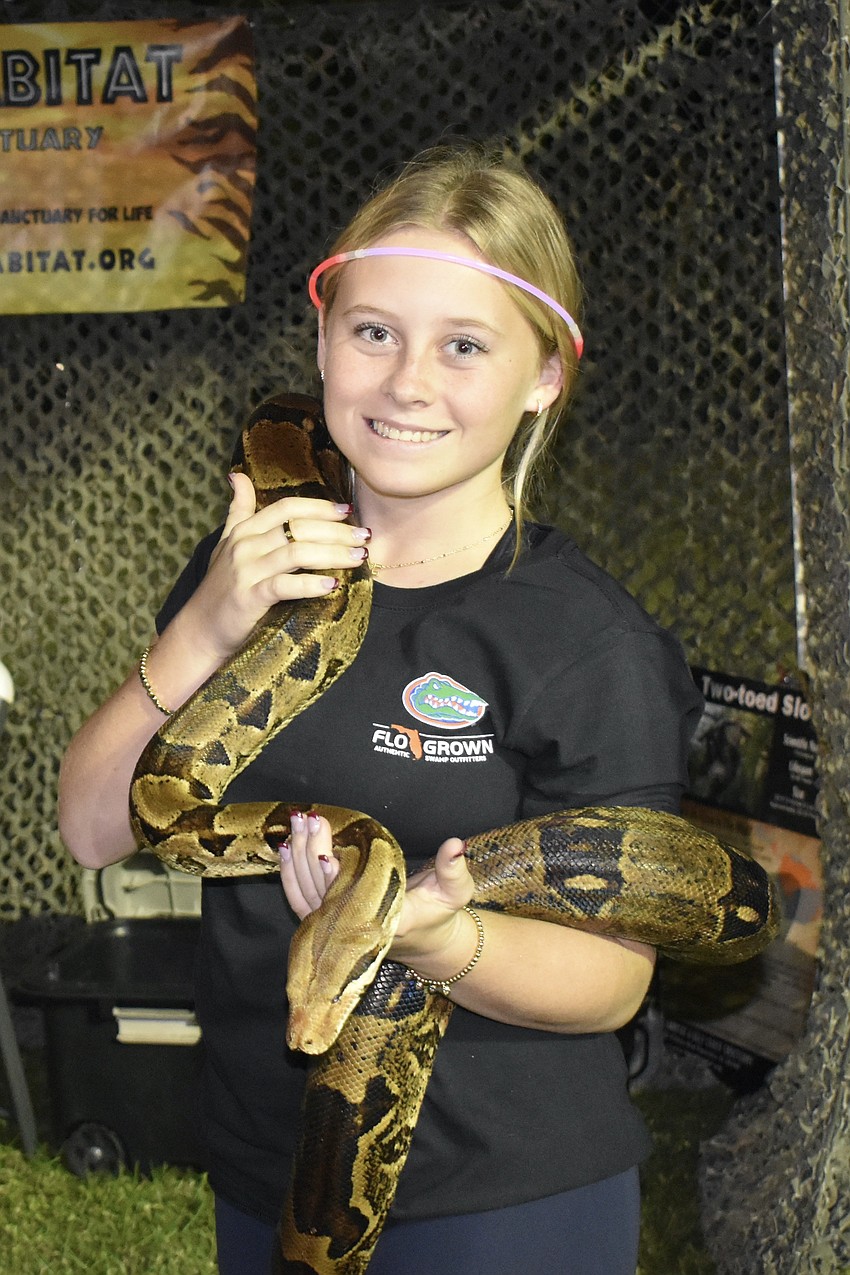 Ella Rosaire, 16, helped represent Big Cat Habitat at the event.