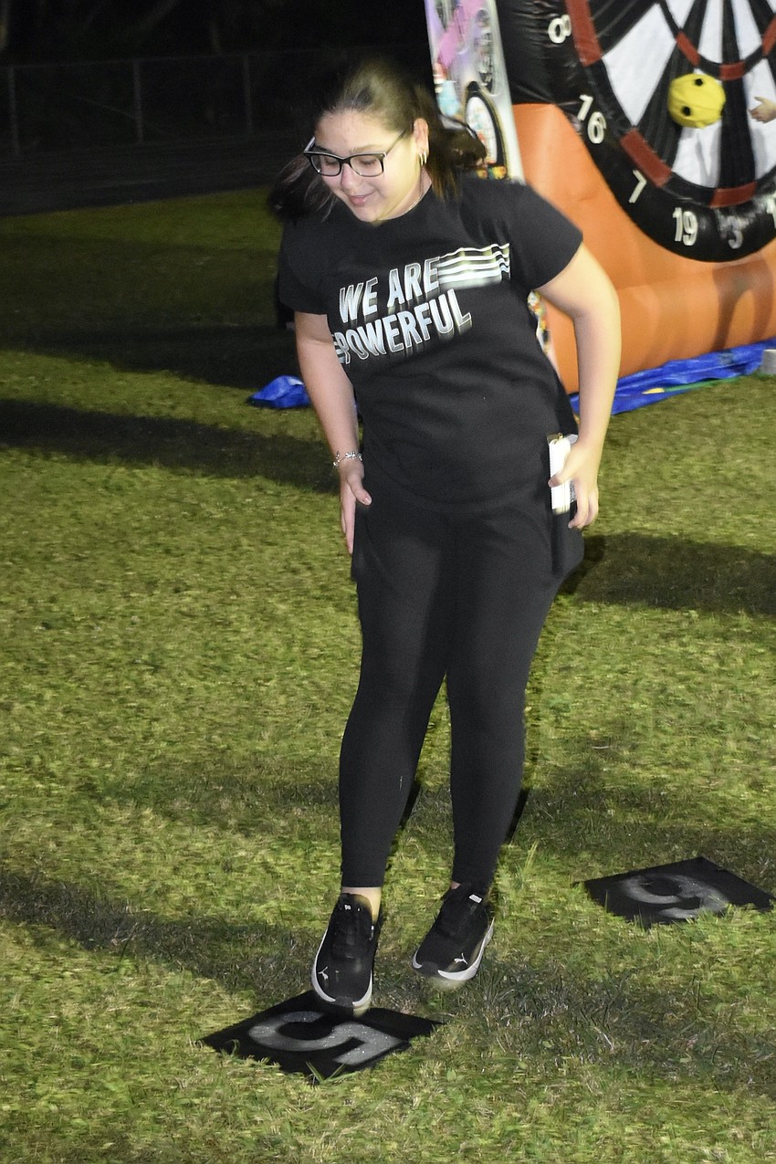 Seventh grader Jimena Gonzalez does the cakewalk.