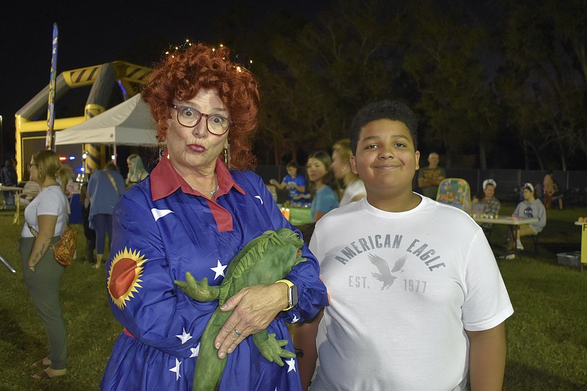 Science teacher Schelly Shaughnessy, dressed as Ms. Frizzle, and sixth grader Eli Jones