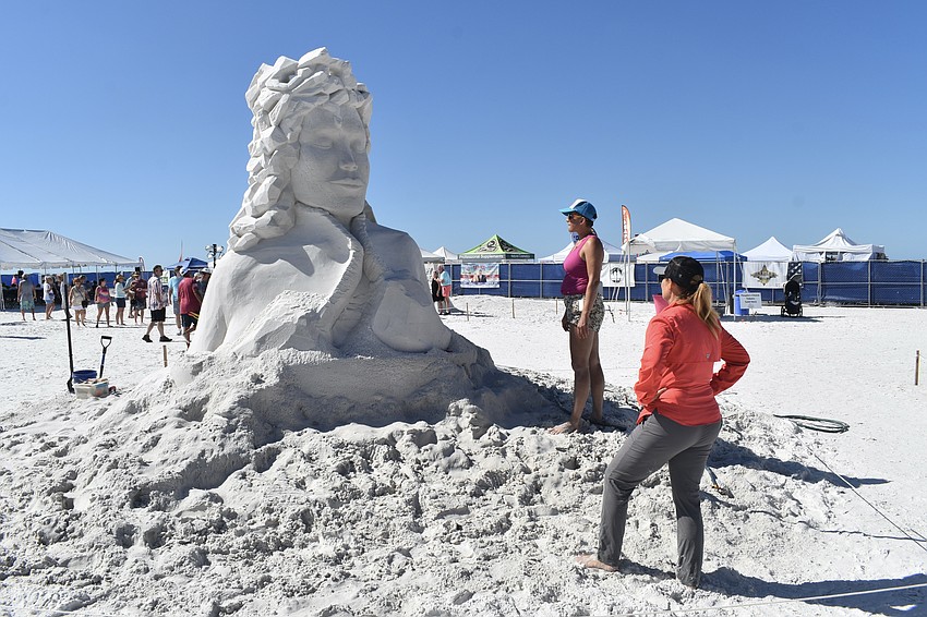 Morgan Rudloff and Amanda Bolduc assess the progress on their sculpture 