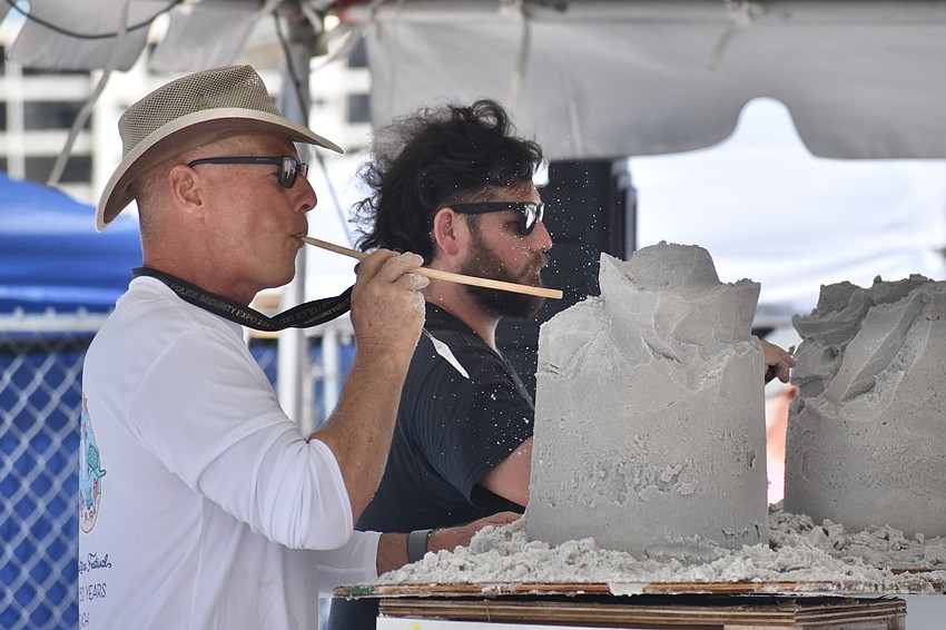 Matthew Deibert and Ian Deibert, a father and son sculpting team, compete in the Quick Sand competition.