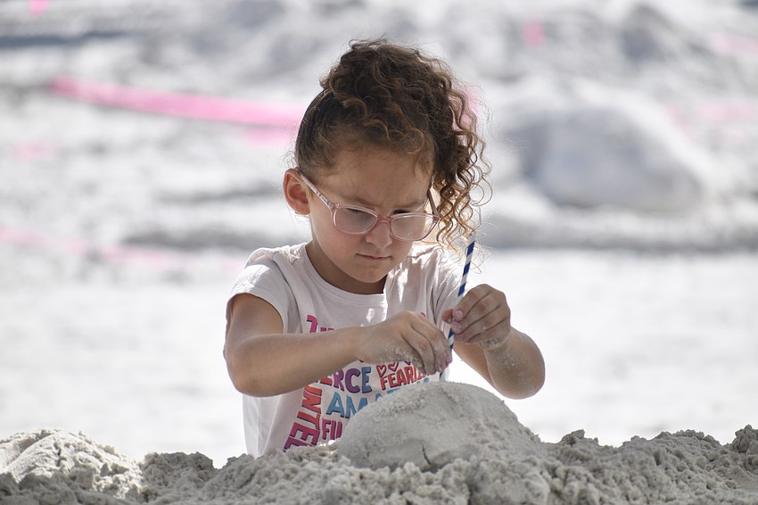 Ashlyn Siilliman, 6, makes a miniature sculpture.