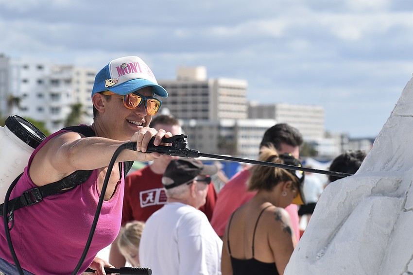 Morgan Rudloff finishes off a sculpture.