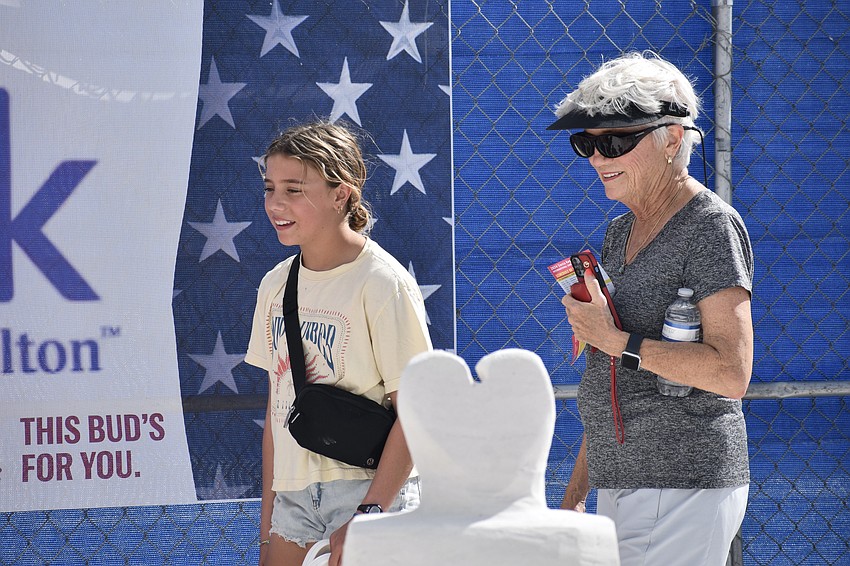 Dylan Ruback, 13, and Cade Sibley explore the amateur sculptures.