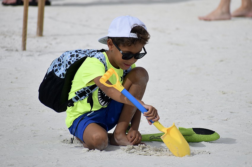 Skyler Dorlus, 6, prepares to dig into the festival experience.