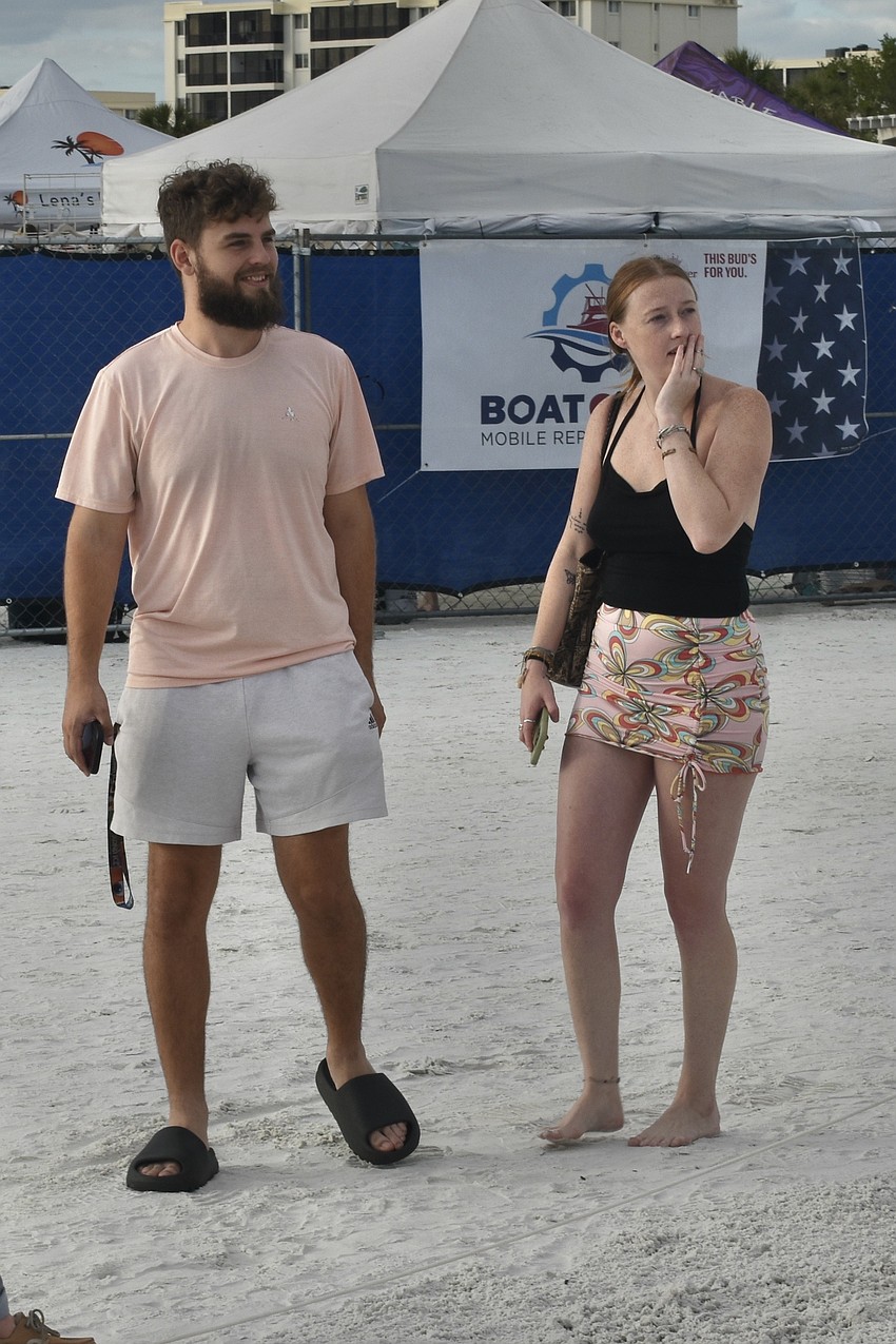 Josh Abrams and Elizabeth King admire the sculpture work.