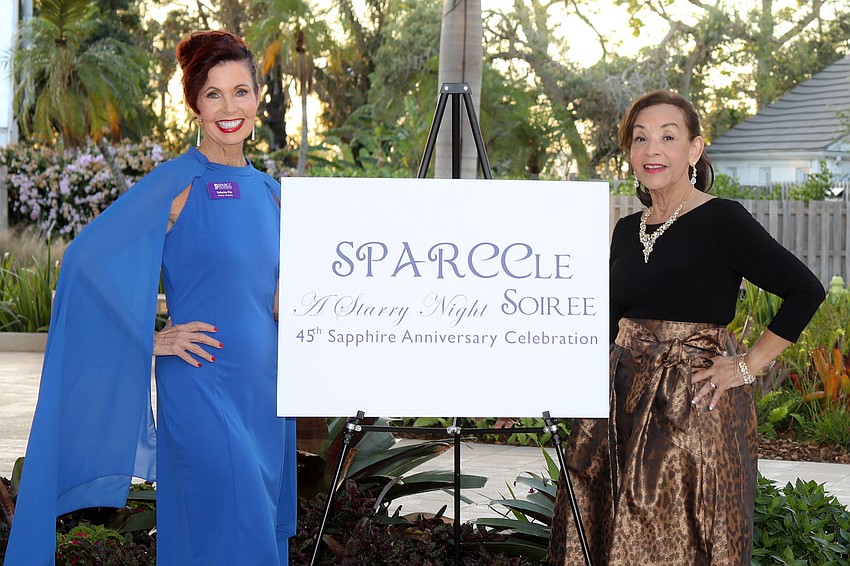 Katherine Pike and Irene Simpson welcome guests to a SPARCCle Starry Night Soirée.