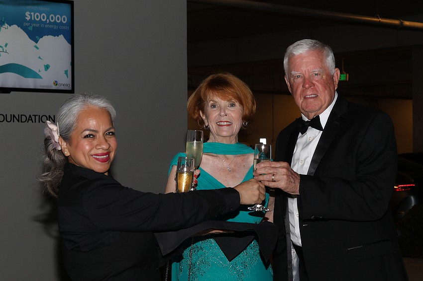 Valet parking and champagne flutes served by Andrea Carbajal await Peggy and Buck Fry.