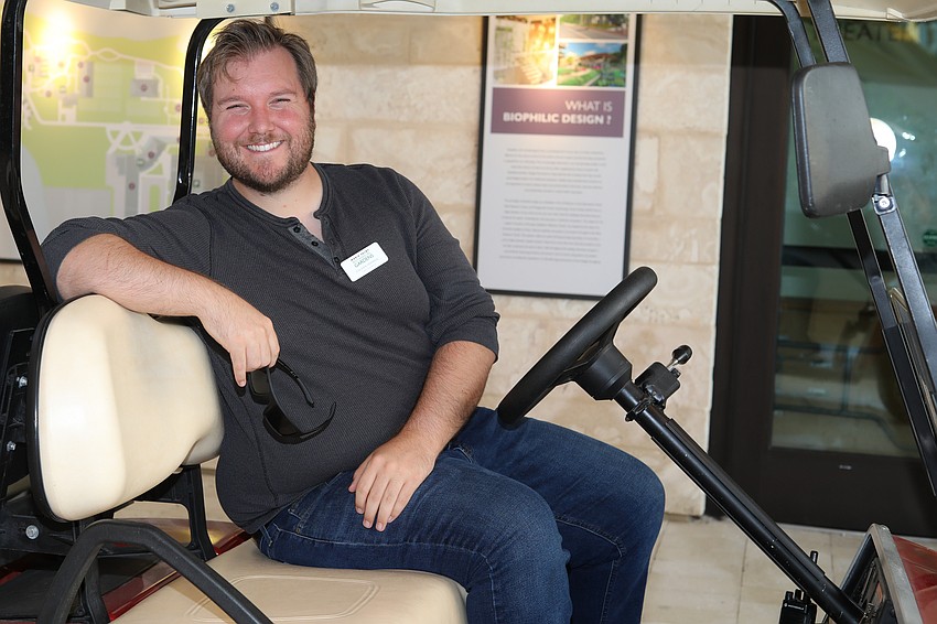 Colson Verheul gives a lift to guests who need assistance getting across the Selby Gardens campus.