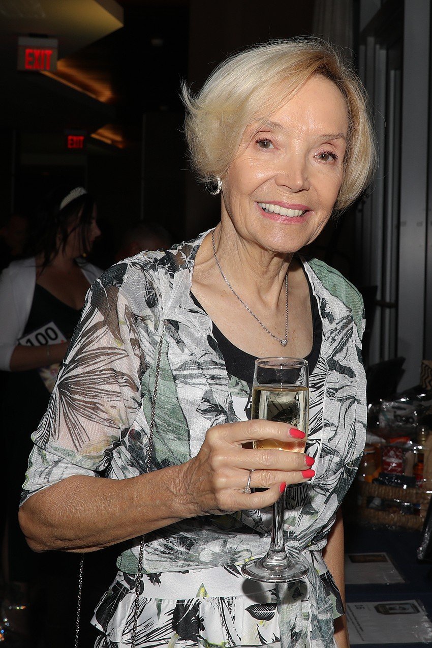 Carol Erickson peruses the silent auction items.