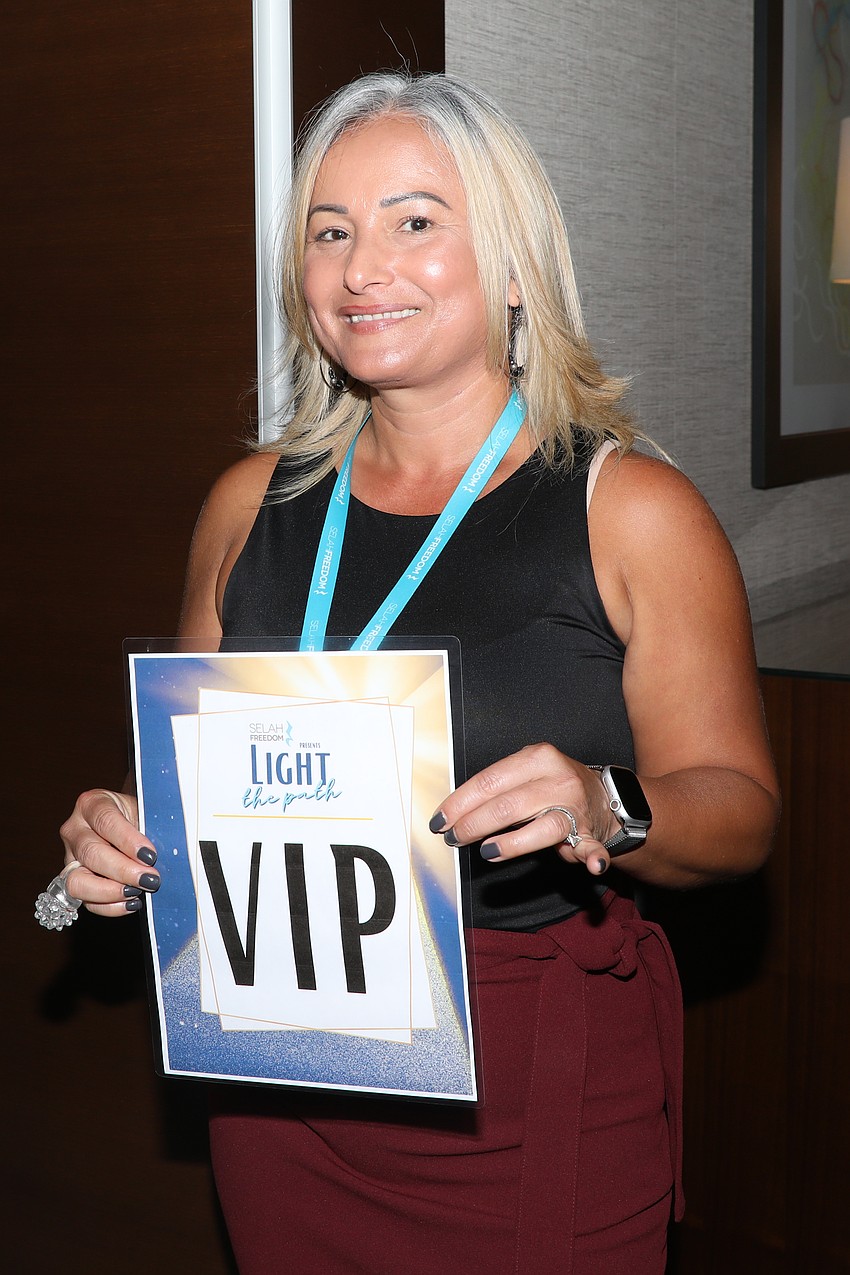 Tameka Murtagh escorts guests into the VIP lounge at the Westin.