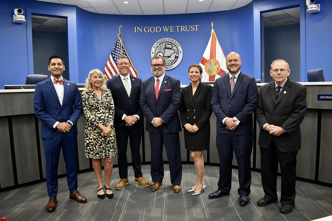 Three new commissioners are sworn in on Nov. 19. The new Manatee County Commission from left to right: Tal Siddique, Carol Felts, George Kruse, Mike Rahn, Amanda Ballard, Jason Bearden and Dr. Robert McCann.