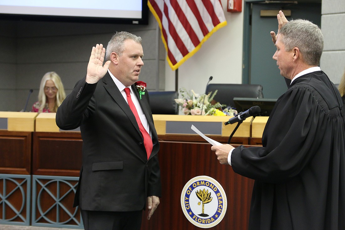 Jason Leslie is sworn into office as mayor of Ormond Beach by Judge Robert Sanders on Tuesday, Nov. 19. Photo by Jarleene Almenas