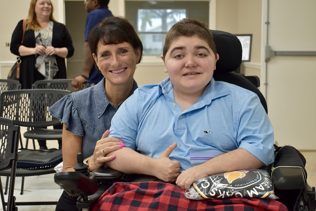 Jennifer and Grayson Tullio attend the dedication ceremony for Dream Oaks Camp on Nov. 20.