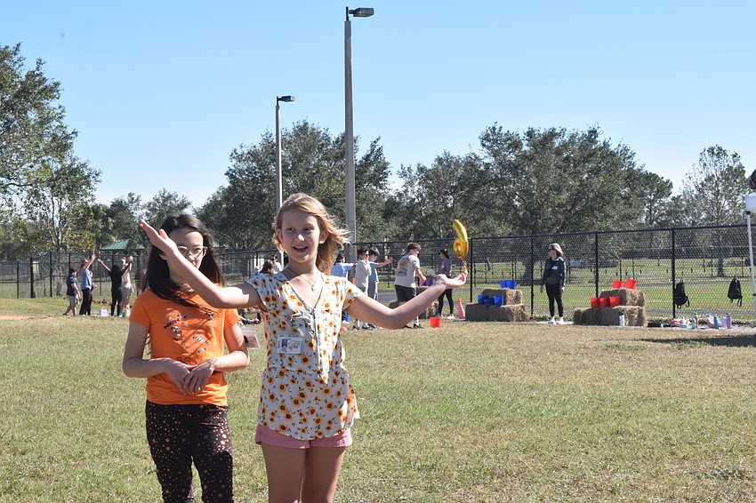 Fifth grader Katherine Ayers dances to the 