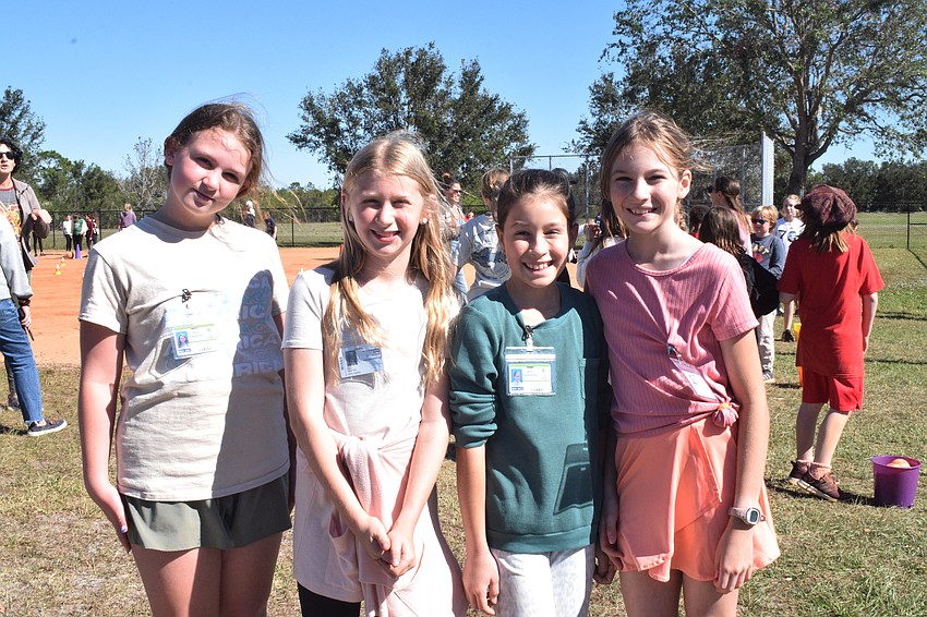 Fifth graders Emma Hendrix, Shelby Hodges, Lily Shahan and Zsofia Dow are getting tired after giving their all at each station. They already had participated in sack races and pumpkin races.