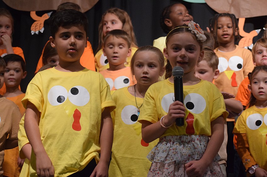 Kindergartners Miles Tateosian and Abigail Green share a Thanksgiving joke.