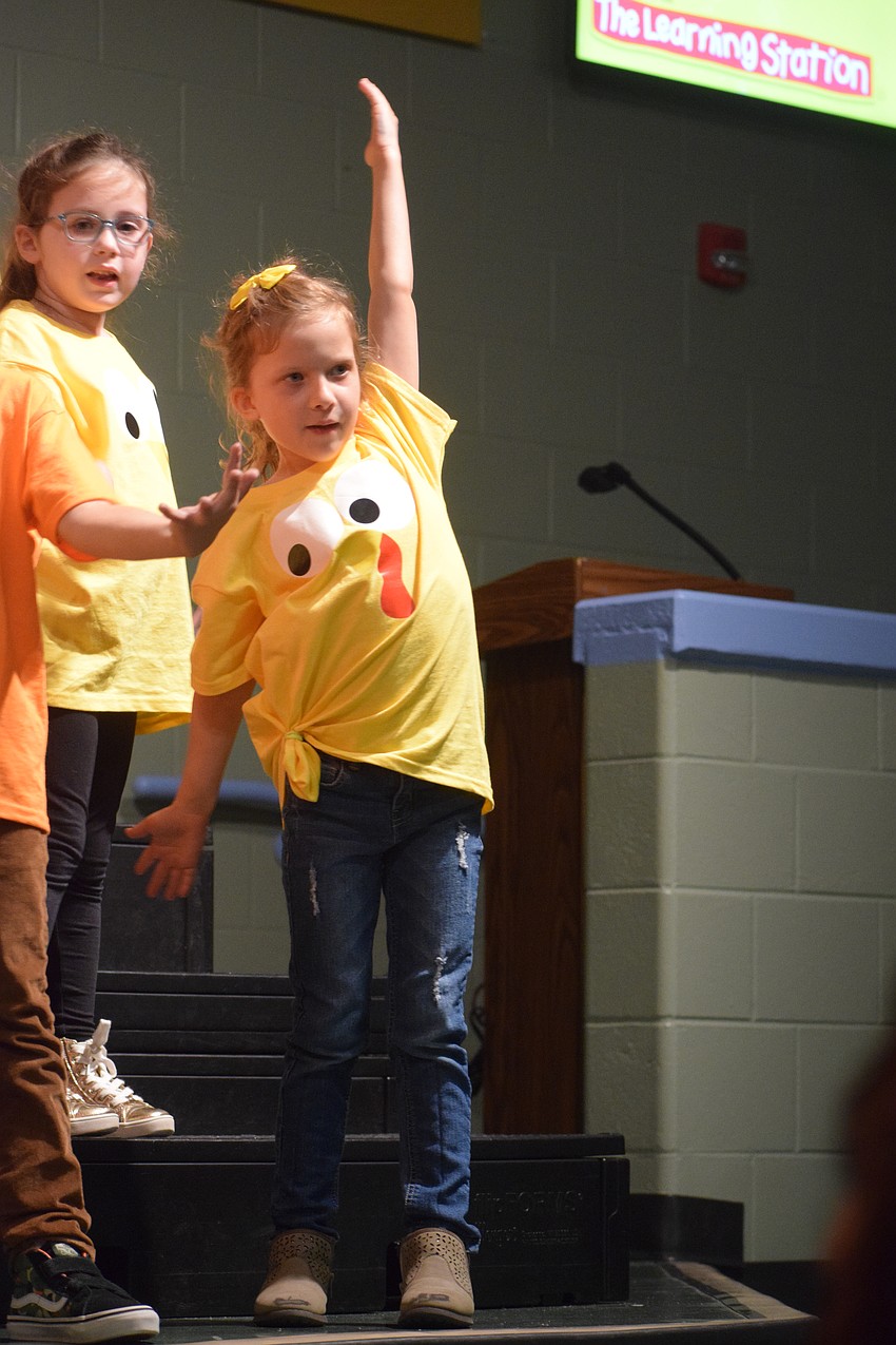 Kindergartner Savannah Cook strikes a pose during the turkey dance.